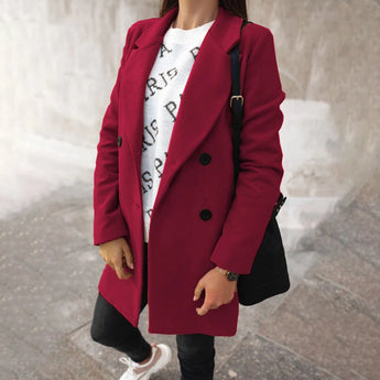 Women's chic urban style double-breasted long red winter coat featuring a tailored fit, prominent collar, full-length sleeves, and waist detailing.