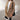 Elegant women's double-breasted long red winter coat with chic urban style, featuring a tailored fit, prominent buttons, and a sophisticated collar, perfect for staying warm in the colder months while maintaining a fashionable look.