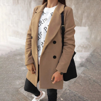 Elegant women's double-breasted long red winter coat with chic urban style, featuring a tailored fit, prominent buttons, and a sophisticated collar, perfect for staying warm in the colder months while maintaining a fashionable look.