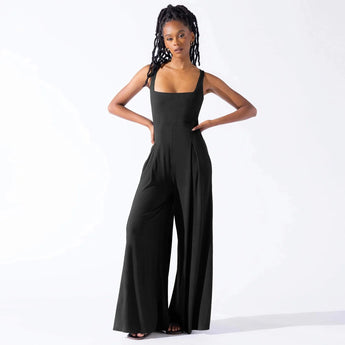 
A woman wearing an elegant black formal wide-leg sleeveless jumpsuit in size 2XL.