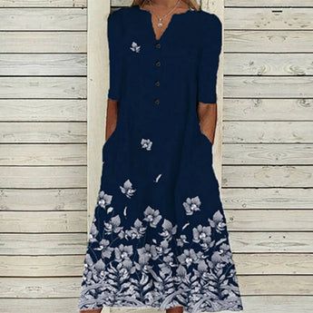 Elegant dark blue midi dress for women featuring a butterfly floral pattern, made of linen material. The dress has a round neck, short sleeves, and a defined waistline, suitable for day wear.