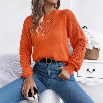 Women's elegant white V-neck knit sweater featuring lantern sleeves, shown in the orange XL variant, styled with jeans and sunglasses.