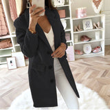 
Image of a women's elegant wool coat in black, tailored with a button front design. The coat features a structured collar, long sleeves, and is styled as an overcoat suitable for business attire. The garment is displayed on a shelf, emphasizing its sleek and sophisticated appearance. Available in size 3XL.
