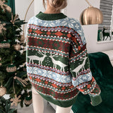 Women's Fair Isle Christmas sweater featuring a cozy blue and white knit design with traditional patterns, modeled by a person showcasing its long sleeves and round neckline.
