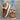Brown corduroy winter loafers with faux fur lining are shown being worn by a person. The loafers are paired with jeans, highlighting their casual and warm design, suitable for cold weather.