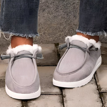 Women's gray faux fur lined winter loafers made of corduroy material, featuring a warm and cozy interior, slip-on design, suitable for casual wear.