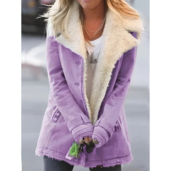 Women's oversized purple fleece lined corduroy jacket with a faux fur collar, featuring long sleeves and a waist-length cut.