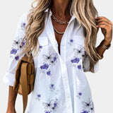 Women's floral blouse with 3/4 sleeves in elegant white and purple design, featuring a V-neckline, displayed in size 2XL.