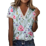 Women's blue floral V-neck lace trim blouse, lightweight summer top in XXL size, featuring lace detailing around the neckline and sleeves.
