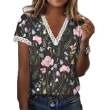 Woman wearing a black XXL floral V-neck lace trim blouse, lightweight summer top with short sleeves and intricate lace detailing near the collar.
