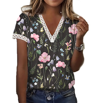 Woman wearing a black XXL floral V-neck lace trim blouse, lightweight summer top with short sleeves and intricate lace detailing near the collar.