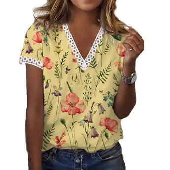 Woman wearing a yellow XXL floral V-neck blouse with lace trim, lightweight summer top, showcasing shoulders and arms.