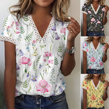 Women's white floral V-neck blouse with lace trim, lightweight summer top, featuring black floral patterns, short sleeves, and stylish design.