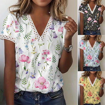 Women's white floral V-neck blouse with lace trim, lightweight summer top, featuring black floral patterns, short sleeves, and stylish design.