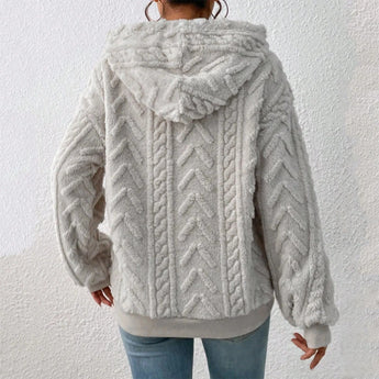 Women's grey fur-lined cable-knit hoodie featuring long sleeves and a cozy collar, designed for winter wear.