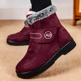 Women's red fur-lined suede snow boots in size 44, showcasing a fashionable design, ideal for winter wear with anti-skid soles.