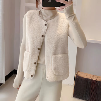 Women's beige fuzzy shearling zip-up vest in 6XL, featuring a soft texture and cozy design perfect for winter fashion. The vest includes a collar and is styled over a white dress shirt.