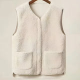 Women's fuzzy shearling zip-up vest in grey and beige tones, featuring a high collar and cozy winter fashion design, perfect for layering over a long-sleeve top.