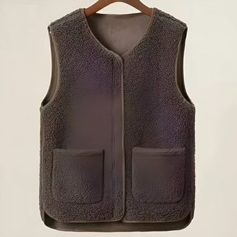 Women's dark brown fuzzy shearling zip-up vest in size 6XL, featuring a cozy and stylish winter fashion design with a silver zipper and collared neckline.