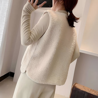 Women's fuzzy shearling zip-up vest featuring a cozy design, highlighting the collar, shoulders, and waist, perfect for winter fashion.