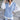 Gray cable knit V-neck sweater vest for women, showcasing a chic layering fashion style.