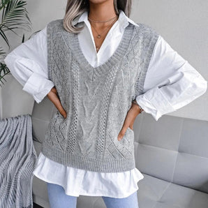 Women's gray cable knit V-neck sweater vest displayed on a mannequin, showcasing the texture and design as part of chic layering fashion.