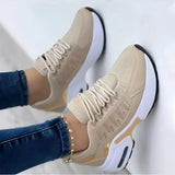 Women's beige lightweight breathable mesh sneakers with ankle support, shown worn with jeans, suitable for outdoor activities.
