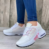 Women's gray lightweight breathable mesh sneakers with ankle support, featuring white and pink accents. The shoes are designed for walking and sportswear, shown against a floor background.