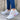 Women's gray lightweight breathable mesh sneakers with ankle support, featuring white and pink accents. The shoes are designed for walking and sportswear, shown against a floor background.