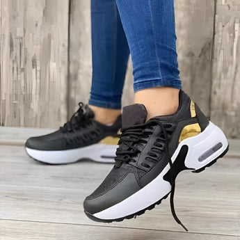 Women's gray lightweight breathable mesh sneakers with ankle support, shown in the color Nero and size 43, featuring a modern design suitable for fashion and sportswear, displayed on a person's feet while standing.