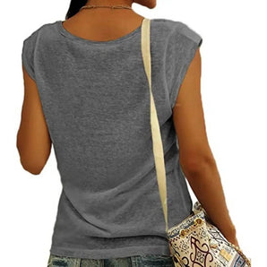 Woman wearing a gray sleeveless tank top made of lightweight cotton with a scoop neck design.