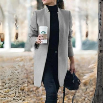 Women's gray wool coat in a slim fit design with a turtleneck collar, featuring long sleeves and a chic, cozy style suitable for fashion-forward outerwear.