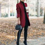 Women's gray wool coat in a slim fit design featuring a cozy turtleneck, showcased in a Bordeaux color, size 4XL. The coat is styled with knee-length sleeves and a tailored waist, emphasizing chic fashion elements.