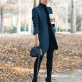 
A women's marine blue wool coat in size 4XL, featuring a slim fit design with a turtleneck.