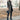 Women's dark gray wool coat with a slim fit design featuring a turtleneck collar, long sleeves, and knee-length coverage, styled for a cozy and chic fashion look.