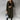 Women's gray wool knee-length coat, featuring a structured shoulder design, classic collar, and tailored sleeves, ideal for urban fashion.