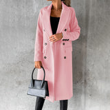 Women's gray wool knee-length coat displayed on a mannequin. The coat features a classic urban fashion design with structured shoulders, long sleeves, and a tailored waistline. The fabric appears warm and suitable for outerwear.
