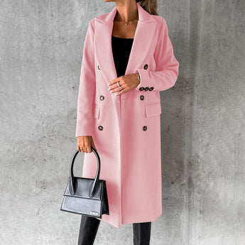 Women's gray wool knee-length coat displayed on a mannequin. The coat features a classic urban fashion design with structured shoulders, long sleeves, and a tailored waistline. The fabric appears warm and suitable for outerwear.