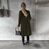 Women's gray wool knee-length coat featuring a stylish collar and waist detail, perfect for urban fashion. The coat is paired with shoes, highlighting the full look.