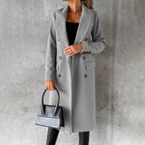 Women's gray wool knee-length coat in an urban fashion style, featuring a structured design with long sleeves and a classic collar, suitable for a sophisticated and modern look. The coat is worn by a standing model, showcasing its fit and elegance in a 3XL size.