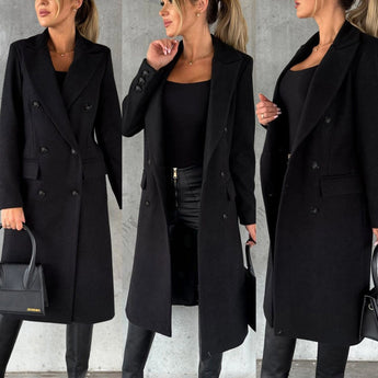 
A stylish woman wearing a gray wool knee-length coat, showcasing urban fashion with a focus on outerwear.