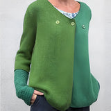 Women's green and blue two-tone color block knit sweater in size 3XL, featuring long sleeves and a crew neck design. The sweater combines shades of green and electric blue, creating a striking visual effect.