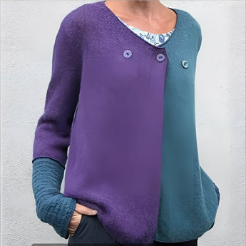 Women's green and blue two-tone color block knit sweater with long sleeves and a round collar, displayed in a 3XL size.