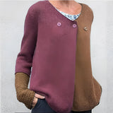 Women's green and blue two-tone color block knit sweater with long sleeves, featuring a crew neck design.
