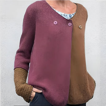 Women's green and blue two-tone color block knit sweater with long sleeves, featuring a crew neck design.