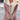 Women's light pink fleece-lined winter coat with sherpa trim detailing, featuring long sleeves and a stylish collar design.