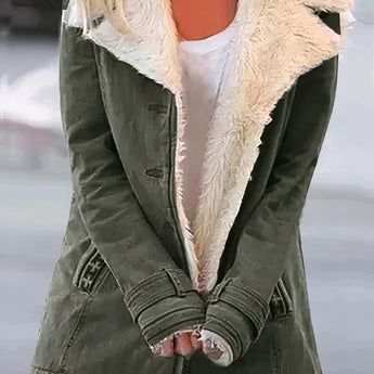 Women's military green fleece-lined winter coat with sherpa trim, featuring a warm collar, long sleeves, and a stylish design suitable for cold weather.