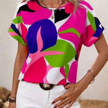 
A women's short sleeve summer blouse with a green leaf print design, shown in a pink color variant, size 2XL. The blouse features a round neck and a relaxed fit, ideal for casual fashion wear.