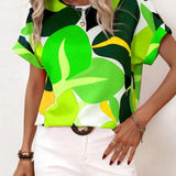 Women's green leaf print blouse, featuring short sleeves and a summer design, displayed in size 2XL.