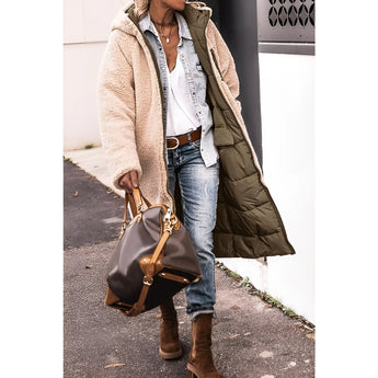 
A women's green sherpa-lined insulated parka featuring a cozy collar and full sleeves. The urban winter coat is designed to provide warmth and style, showcasing a sleek waistline.